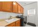 Laundry room featuring lots of cabinet space with a washing machine and dryer at 215 Great Gable Dr, Las Vegas, NV 89183