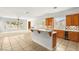Bright living area featuring tile floors, a kitchen bar, and plentiful natural light at 215 Great Gable Dr, Las Vegas, NV 89183