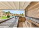 Granite countertop with outdoor kitchen, stainless steel appliances, grill, and outdoor sink, overlooking backyard and pool at 215 Great Gable Dr, Las Vegas, NV 89183