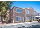 Charming two-story townhome featuring a well-maintained exterior and nicely landscaped front yard at 2166 Sleepy Ct, Las Vegas, NV 89106