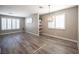 Bright living room with hardwood floors, recessed lighting, and stylish light fixture at 2166 Sleepy Ct, Las Vegas, NV 89106