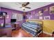 Cozy bedroom with hardwood floors, ceiling fan, and natural light at 2180 Polynesia Cir, Henderson, NV 89074
