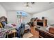 Spacious bedroom featuring hardwood floors, natural light, and ceiling fan at 2180 Polynesia Cir, Henderson, NV 89074