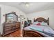 Bedroom with hardwood floors, ceiling fan, and bright, vaulted ceiling at 2180 Polynesia Cir, Henderson, NV 89074