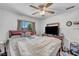 Bedroom with hardwood floors, natural light, and ceiling fan at 2180 Polynesia Cir, Henderson, NV 89074