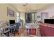 Bright dining area with sliding glass doors and chandelier lighting fixture at 2180 Polynesia Cir, Henderson, NV 89074