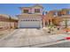 Charming two-story home featuring a well-maintained front yard with xeriscape landscaping at 2180 Polynesia Cir, Henderson, NV 89074