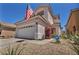 Charming two-story home featuring a well-maintained front yard with xeriscape landscaping at 2180 Polynesia Cir, Henderson, NV 89074