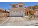 Charming two-story home featuring a well-maintained front yard with xeriscape landscaping at 2180 Polynesia Cir, Henderson, NV 89074