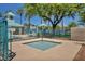 Inviting community hot tub area offers an intimate, fenced-in area for relaxation with nearby lounge seating at 2180 Polynesia Cir, Henderson, NV 89074