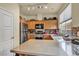 Modern kitchen with stainless steel appliances, quartz countertops, and ample storage at 2180 Polynesia Cir, Henderson, NV 89074