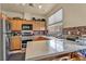 Well-equipped kitchen featuring stainless steel appliances and quartz countertops at 2180 Polynesia Cir, Henderson, NV 89074