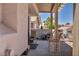 Inviting covered patio with seating, offering a relaxing outdoor living space with desert landscaping at 2180 Polynesia Cir, Henderson, NV 89074