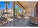 Covered patio with chairs and view of landscaped backyard at 2180 Polynesia Cir, Henderson, NV 89074