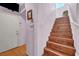 Entryway with a wooden staircase leading to the upper level at 2180 Polynesia Cir, Henderson, NV 89074