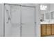 Bathroom shower with glass doors and updated hardware at 2485 Jade Sky St, Henderson, NV 89044