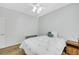 Bedroom features wood floors, ceiling fan, and small side table at 2485 Jade Sky St, Henderson, NV 89044