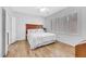 Bright bedroom boasts wood floors, ceiling fan, and window shutters at 2485 Jade Sky St, Henderson, NV 89044