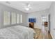Bedroom with wood floors, shutters, and tv at 2485 Jade Sky St, Henderson, NV 89044