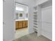 Walk-in closet with built-in shelving, conveniently located near a well-lit bathroom at 2485 Jade Sky St, Henderson, NV 89044