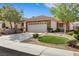 Inviting single-story home featuring a two-car garage and well-maintained landscaping for a cozy feel at 2485 Jade Sky St, Henderson, NV 89044