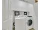 Laundry room featuring white washer and dryer with shelving and white doors at 2485 Jade Sky St, Henderson, NV 89044