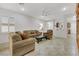 Spacious living room with tile floors, neutral walls, and plenty of seating for a comfortable atmosphere at 2485 Jade Sky St, Henderson, NV 89044