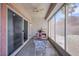 Comfortable covered patio with ceiling fan and views of the well-maintained backyard landscaping at 2485 Jade Sky St, Henderson, NV 89044