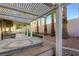 A pergola covers a spa and patio with artificial turf in the backyard at 249 Gentle Springs Dr, Henderson, NV 89012