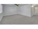 Spacious carpeted bedroom featuring a ceiling fan and neutral colors at 249 Gentle Springs Dr, Henderson, NV 89012