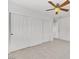 Bright bedroom featuring a ceiling fan and spacious closet with sliding doors at 249 Gentle Springs Dr, Henderson, NV 89012