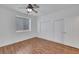 Cozy bedroom features laminate wood flooring, window with blinds and closet at 249 Gentle Springs Dr, Henderson, NV 89012