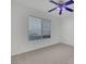 Sunny bedroom featuring a window with blinds and neutral carpeting at 249 Gentle Springs Dr, Henderson, NV 89012