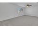 Carpeted bedroom featuring a ceiling fan and window views at 249 Gentle Springs Dr, Henderson, NV 89012