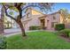 Charming two-story home featuring a well-manicured lawn and desert landscaping at 249 Gentle Springs Dr, Henderson, NV 89012