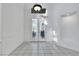 Bright foyer featuring tiled floors, high ceilings, and an ornate glass double-door entrance at 249 Gentle Springs Dr, Henderson, NV 89012