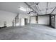 Spacious two-car garage with ample storage cabinets and room for vehicles and tools at 249 Gentle Springs Dr, Henderson, NV 89012