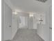 Well-lit hallway with neutral walls and carpet flooring at 249 Gentle Springs Dr, Henderson, NV 89012