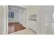 Entryway with tile flooring opens to the bedroom with hardwood floors at 249 Gentle Springs Dr, Henderson, NV 89012