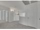Hallway with neutral walls, carpet flooring, and decorative light fixtures at 249 Gentle Springs Dr, Henderson, NV 89012