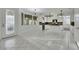 Open concept kitchen featuring white cabinets, an island, and a seamless transition to the living area at 249 Gentle Springs Dr, Henderson, NV 89012