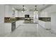 Modern kitchen boasting granite countertops, stainless steel appliances, a center island, and white cabinets at 249 Gentle Springs Dr, Henderson, NV 89012