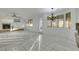 Spacious living area with tile floors, a fireplace, a ceiling fan, and bright lighting at 249 Gentle Springs Dr, Henderson, NV 89012