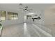 Open-concept living room with tile floors and modern ceiling fan at 249 Gentle Springs Dr, Henderson, NV 89012