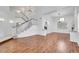 Spacious living room featuring hardwood floors, a grand staircase, and abundant natural light at 249 Gentle Springs Dr, Henderson, NV 89012