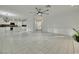 Open-concept living room with tile flooring that leads to kitchen area at 249 Gentle Springs Dr, Henderson, NV 89012