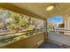Balcony with lush green view offering serene outdoor living space and natural light at 2633 S Durango Dr # 201, Las Vegas, NV 89117