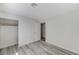 This bedroom boasts an open closet with sliding doors, interior shelving, and gray-toned flooring at 2633 S Durango Dr # 201, Las Vegas, NV 89117