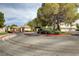 Gated community entrance featuring mature trees and manicured landscaping offering privacy at 2633 S Durango Dr # 201, Las Vegas, NV 89117