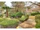 Beautifully landscaped grounds with lush greenery, palm trees, and charming walkways near the building at 2633 S Durango Dr # 201, Las Vegas, NV 89117